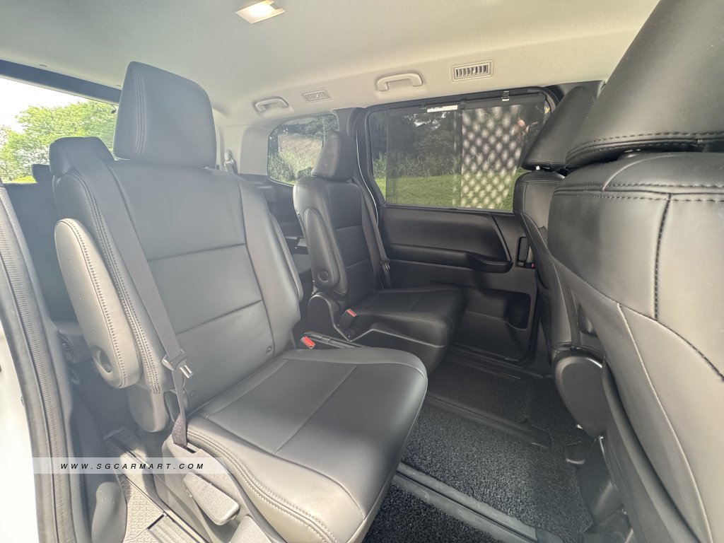 Spacious rear cabin of the Toyota Noah with 7-seater configuration and rear air-con vents.